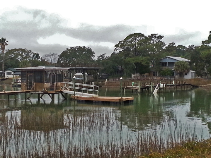 House and dock on a large salt water marsh - approaching the beach area on Tybee Island