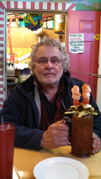 Richard at A-Js Dockside Restaurant with the just right size Bloody Mary - Tybee Island