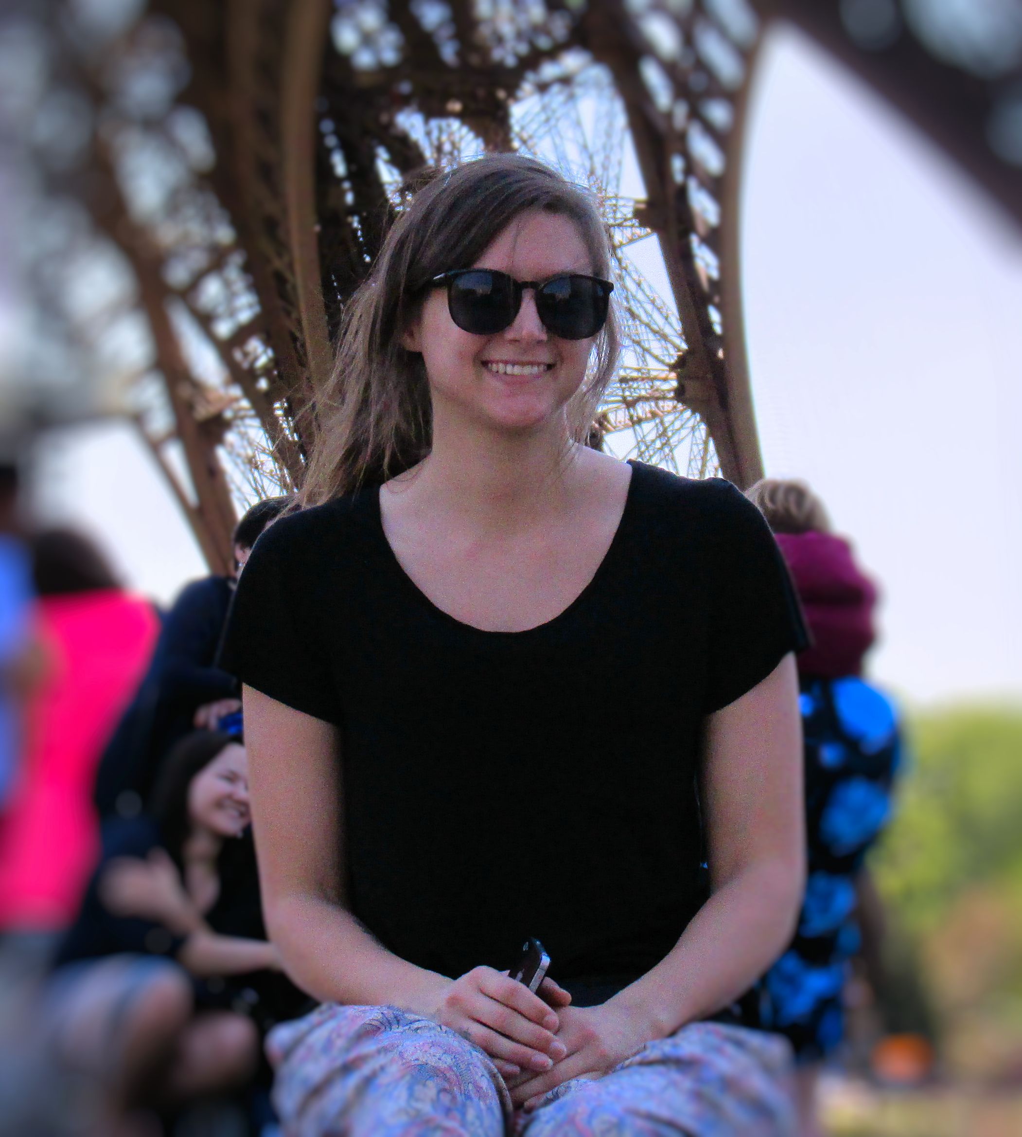 Katie under the shadow of the Eiffel Tower. 