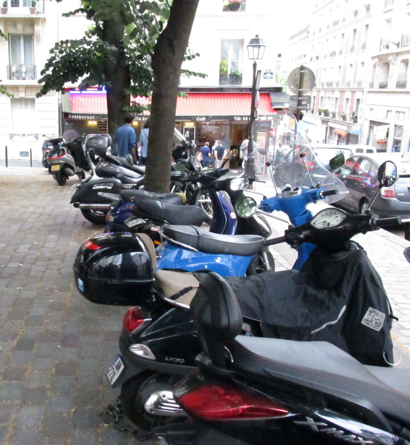 Scooters are plentiful and are parked anywhere their drivers can find a spot.