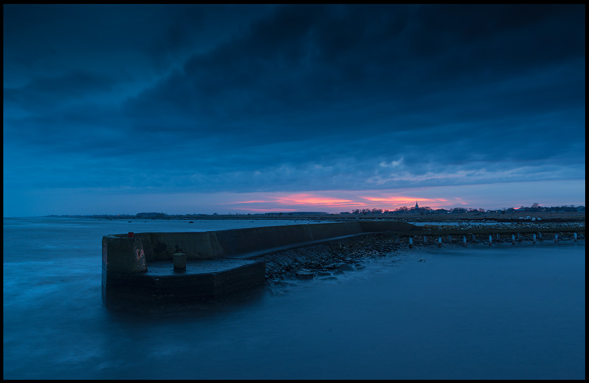 Grsgrds harbor and church at dusk