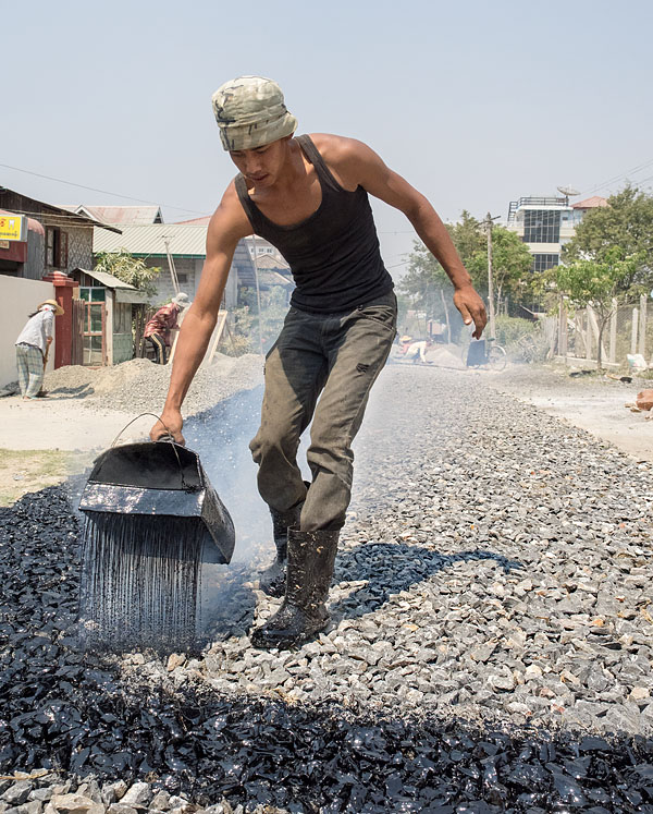 Road construction; The liquid tar is distributed to the new road