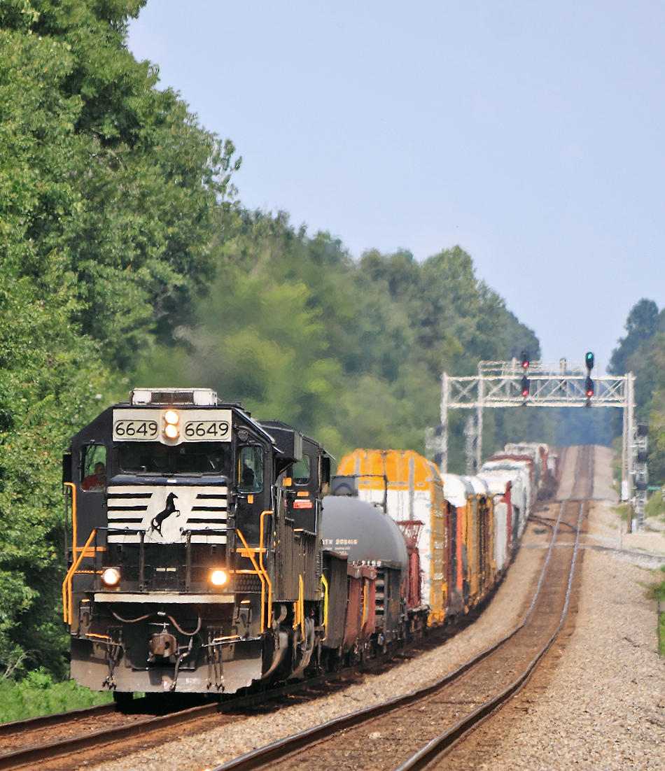 A spartan cab SD60 leads train 117 through the roller coaster profile at Gradison 