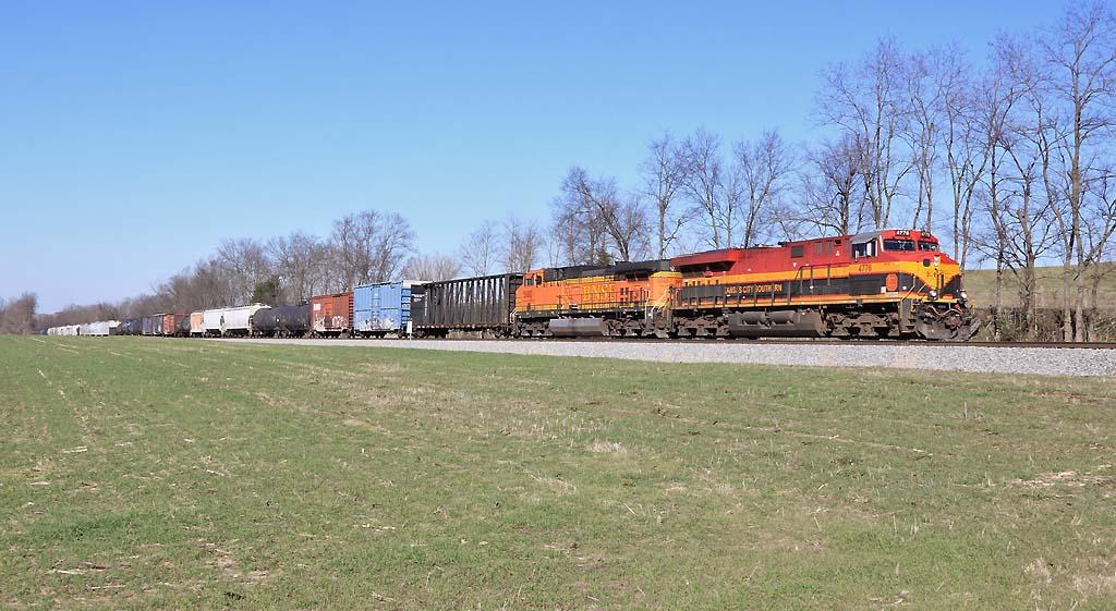 NS 123 eases down the valley near McKinney with a mix of KCS and BNSF power 
