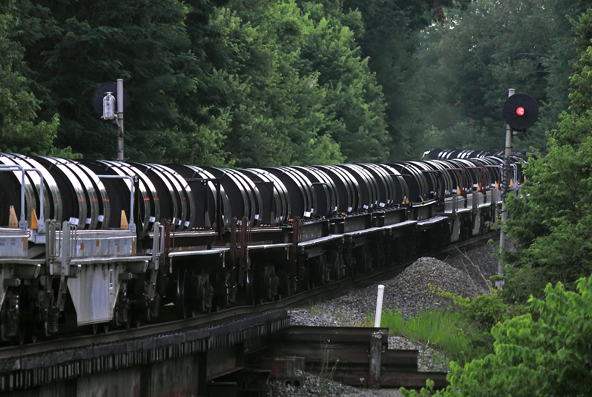 NS 60R stretches out through the dip at Salvisa as a light rain falls 