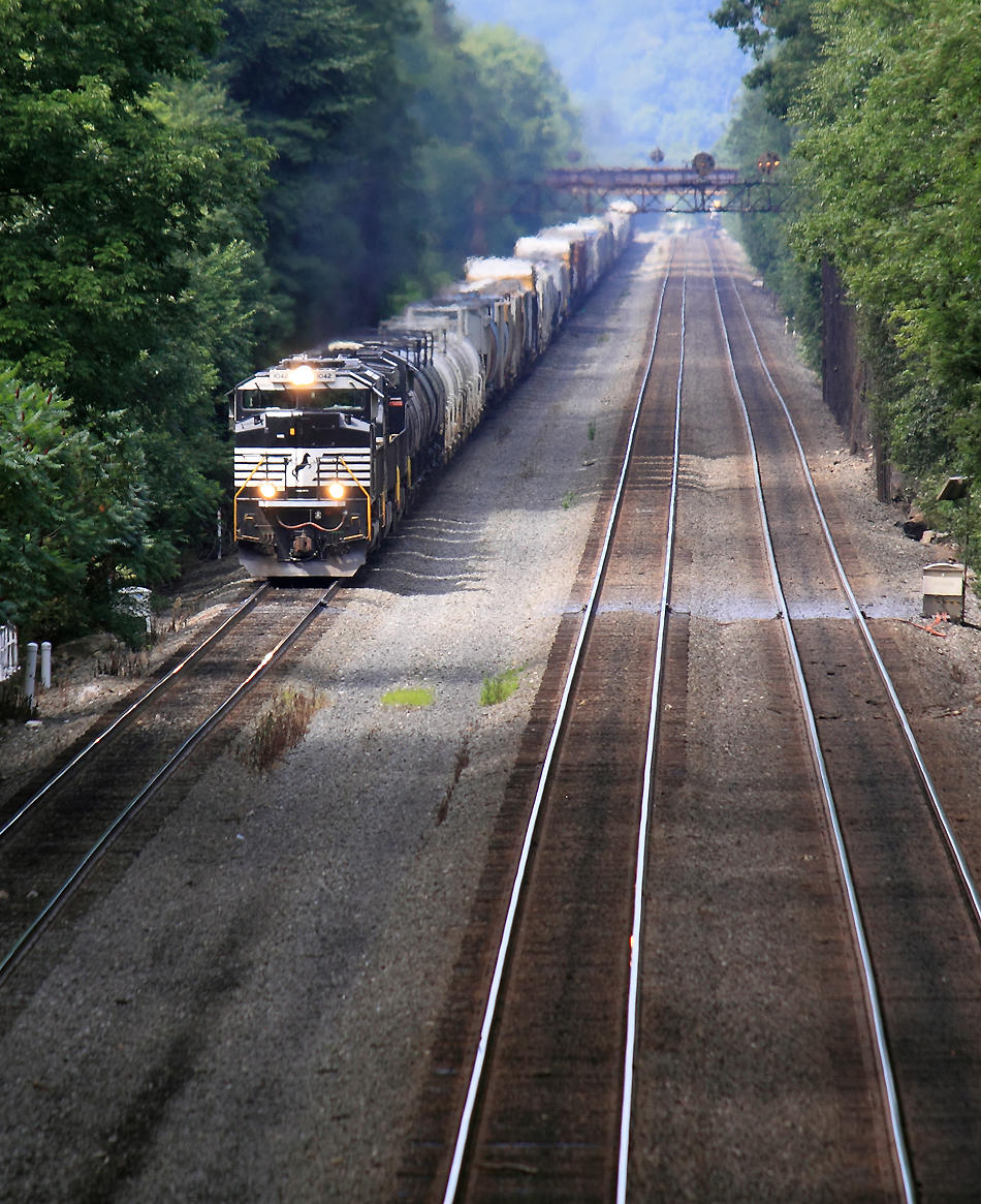 A Eastbound manifest rolls under the Portage signals 