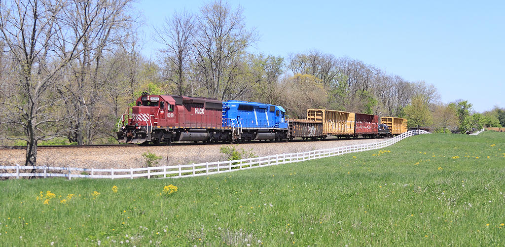 CSX J767 (The Worthville Local) sprints across the top of the hill near Verona Southbound 