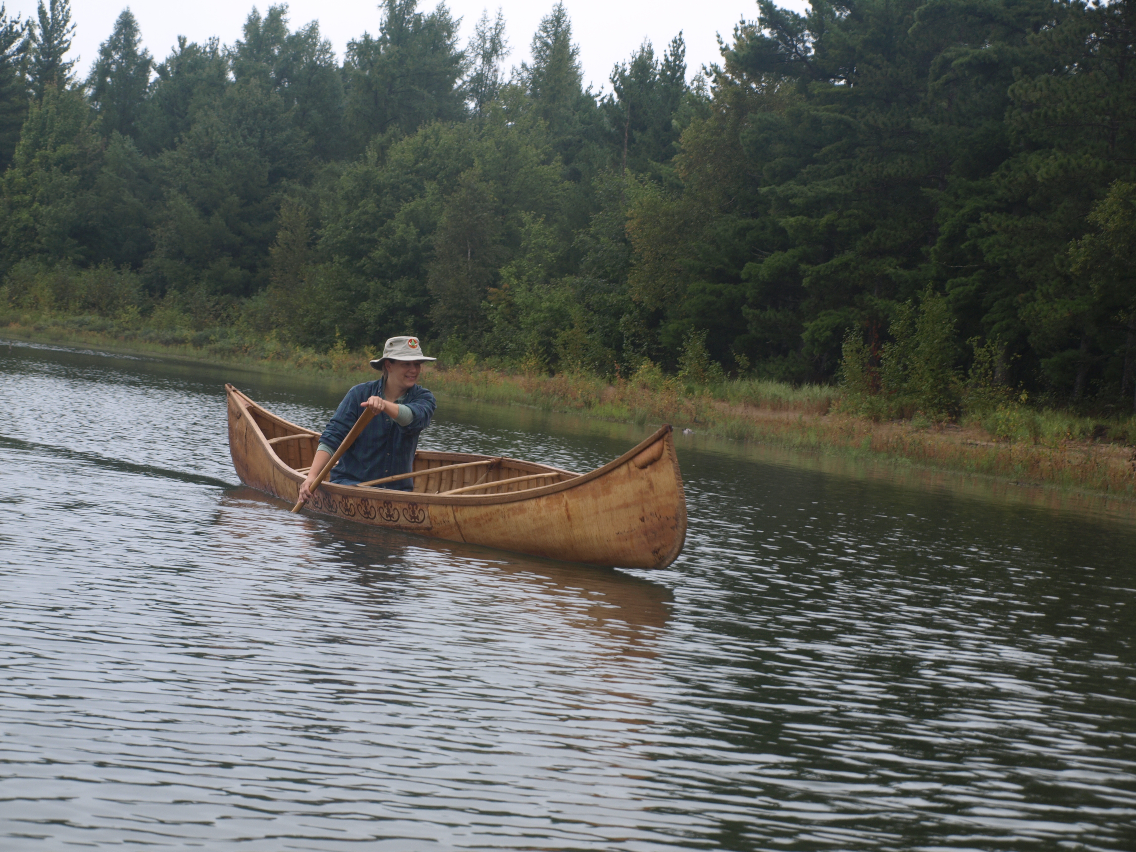 Jody Paddling Birch Bark Canoe
