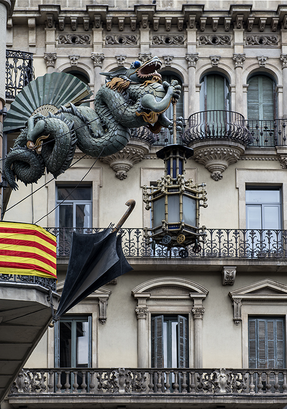Modernista dragon showing off a building