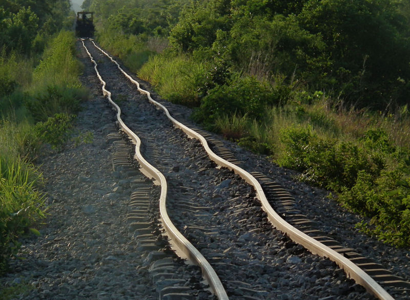 Mangled rail lines and sleepers  after derailment, alongside Park
