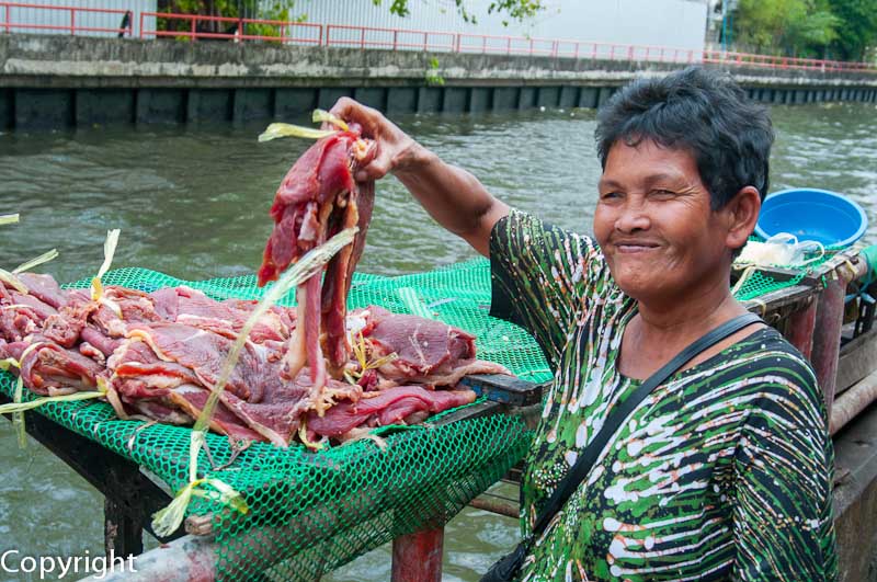 Woman butcher near Wat Mai Chong Lom