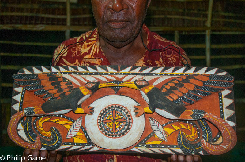 Demas Kavavu, an elder at Bol, displays a carved breastplate