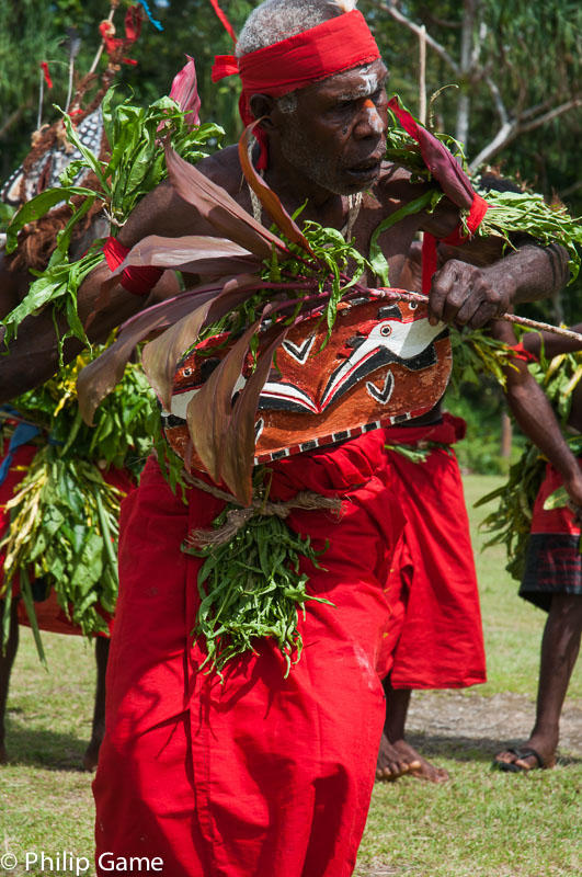 Demas Kavavu leads a traditional dance of welcome