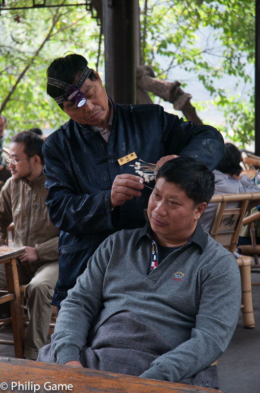 Ear cleaning at Peoples Park 