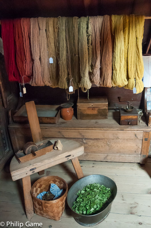 Dyed woollen yarns hanging in a farmstead at Skansen