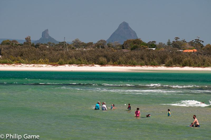 The Glasshouse Mountains punctuate the horizon