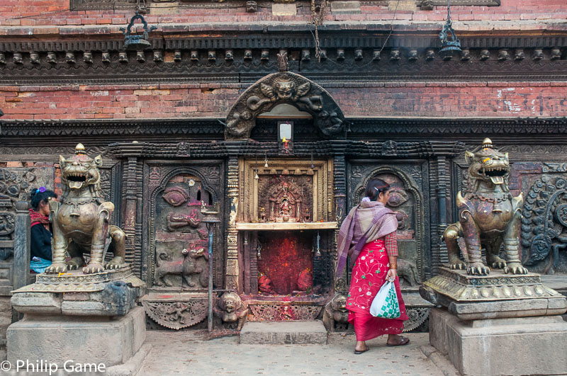 Woman at a shrine to the demon god Bhairab