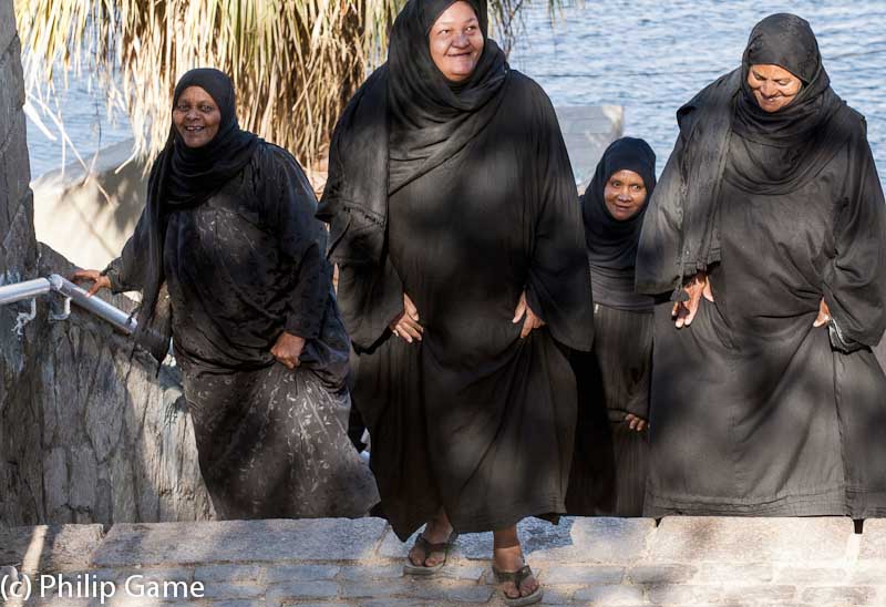 Village women disembark from a ferry