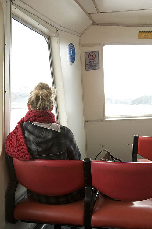 Ferry passenger, lost in thought, whilst crossing Sydney Harbour