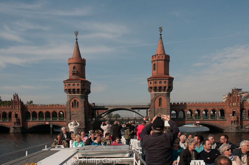 Tour vessels pass under the Oberbaumbrücke, which spans the Spree