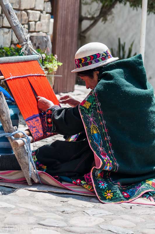 Jal'qa woman weaving outside the ASUR Indigenous Art Museum