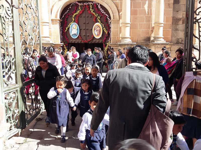 Schoolchildren spill out of the Metropolitan Cathedral after mass