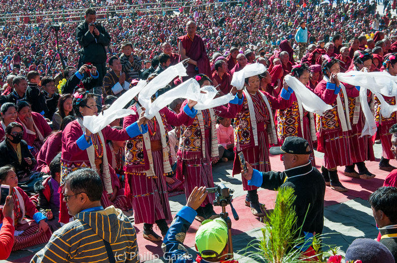 Massed dancers welcome the Karmapa Lama to Tawang