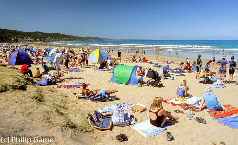 Summer holiday crowds on the main beach at Lorne