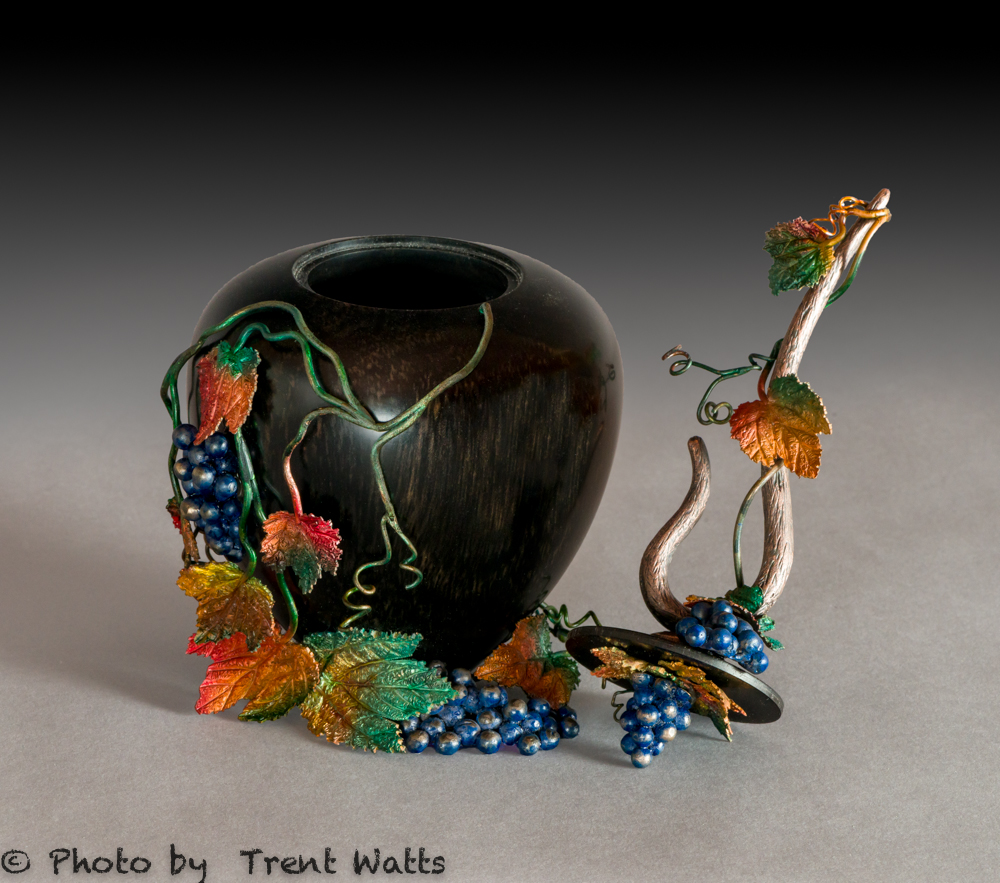Turned Ebony lidded box with cast bronze and copper with patina.