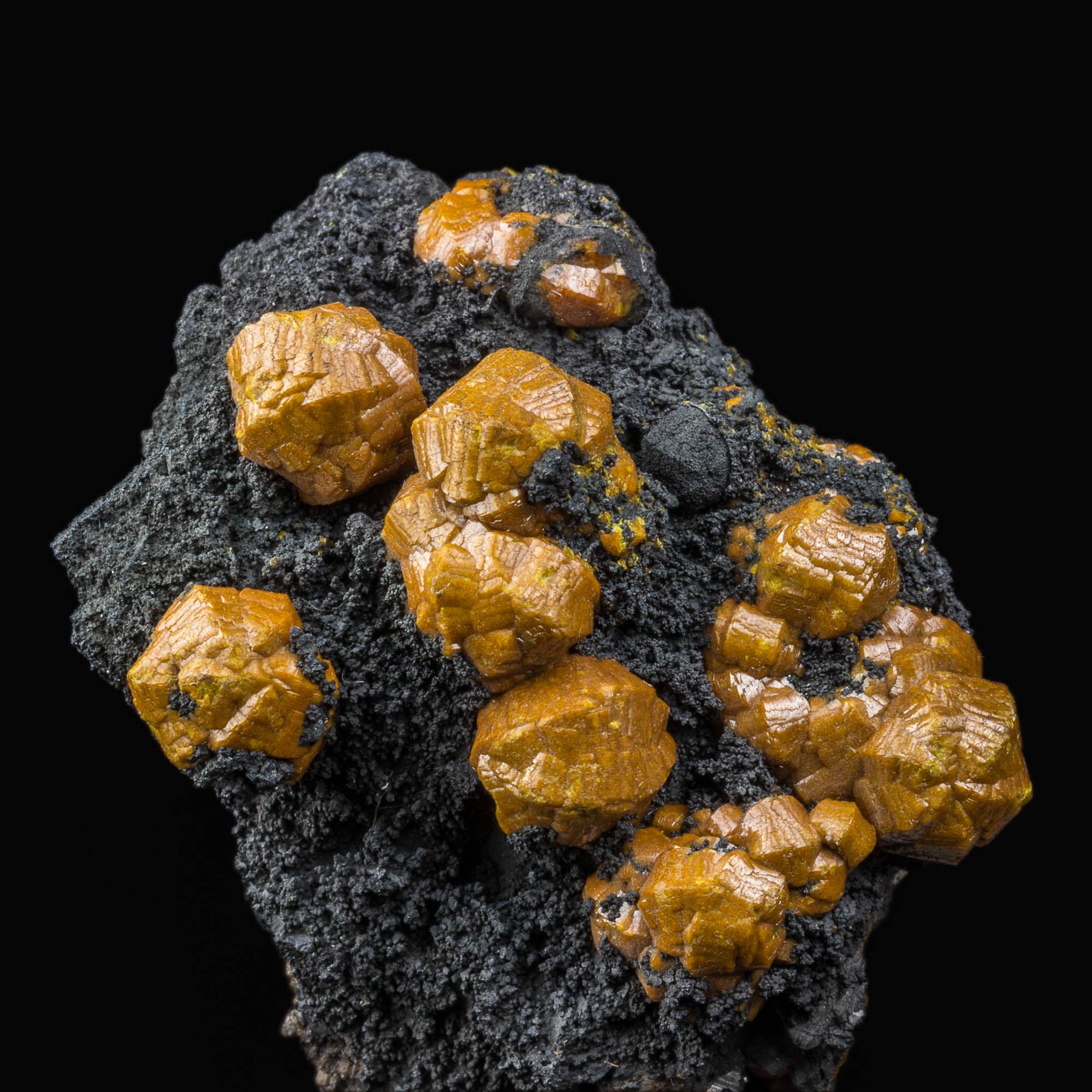 Campylite crystals to 1 cm on manganese oxide matrix. Drygill Mine, Caldbeck Fells.