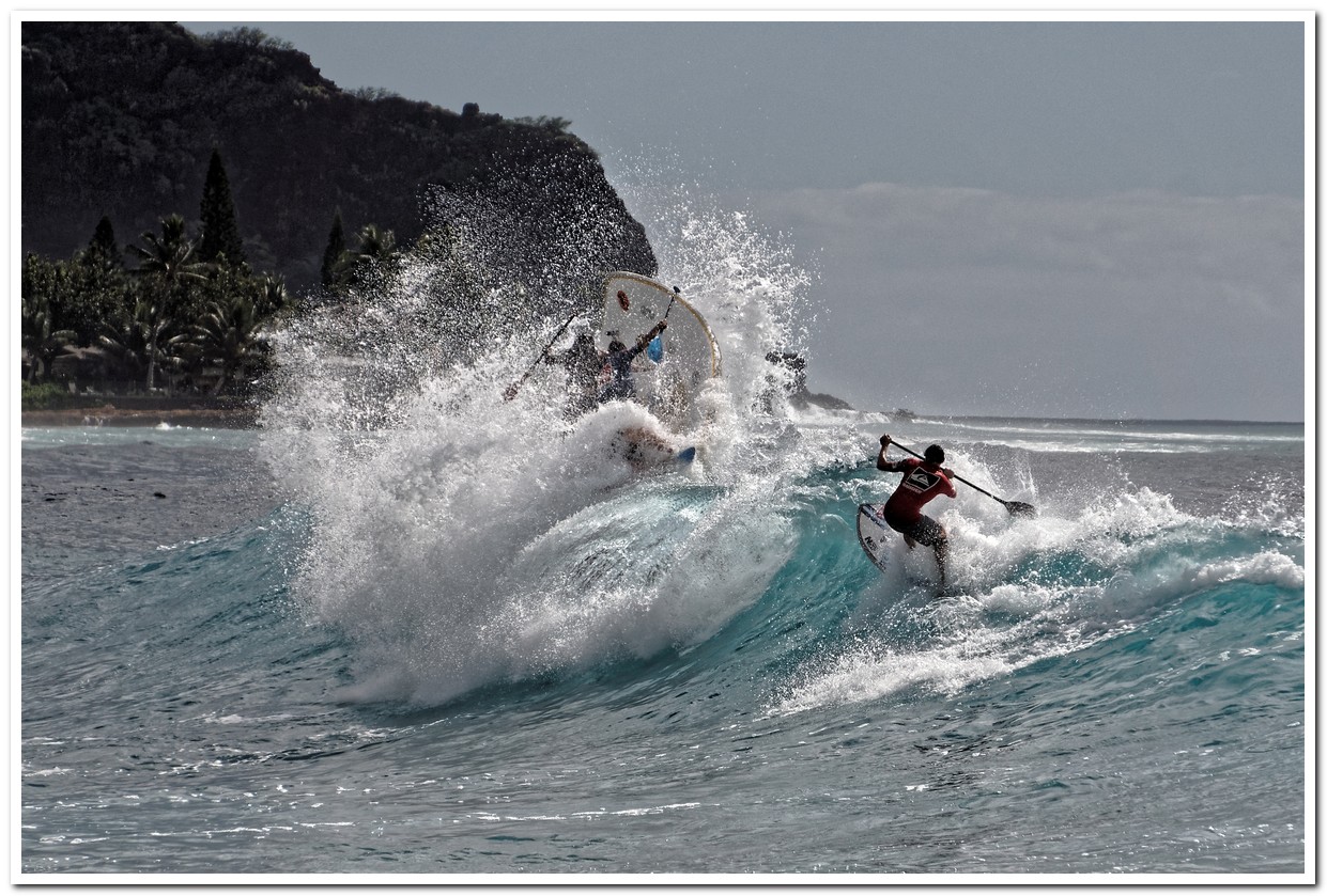 Paddle board surfer avoiding surf squatch, Makaha