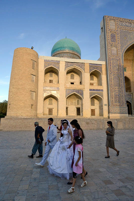Bukhara, grooms in front of Mir-i-Arab Medressa