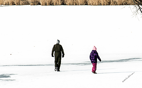 Father and daughter taking an advantage of a nice winter day and a frozen lake for a nice little walk.
An image may be purchased at http://edward-peterson.artistwebsites.com/featured/father-and-daughter-edward-peterson.html