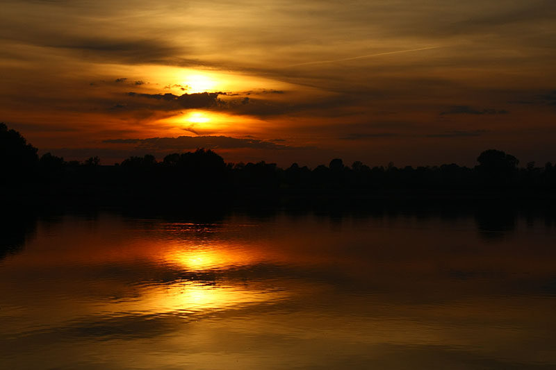 Four suns sunset at Biskupins Lake