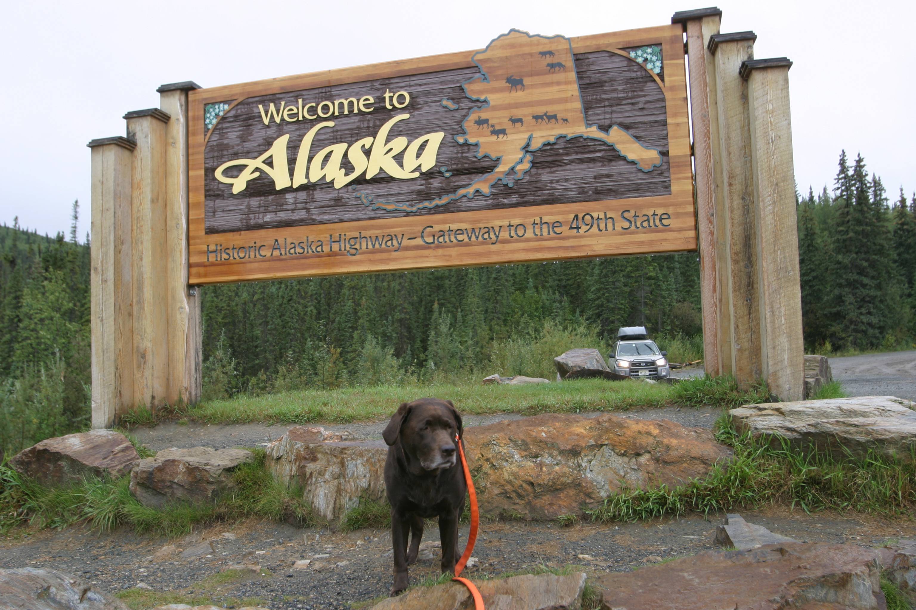 Sasha at the Alaska Welcome Sign (IMG_0785.JPG)