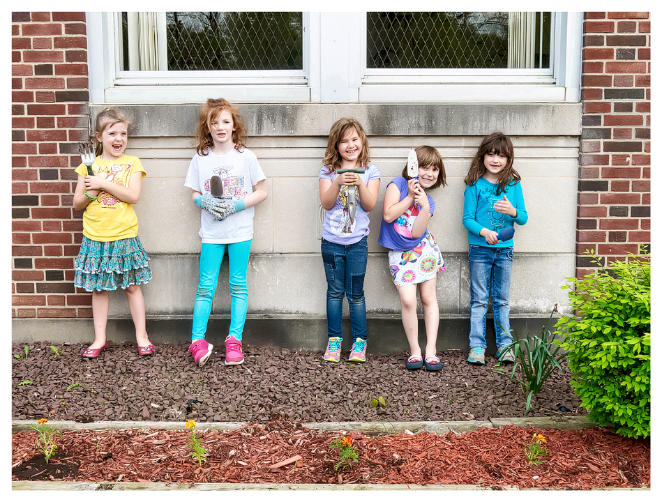 Planting with her Daisy troop