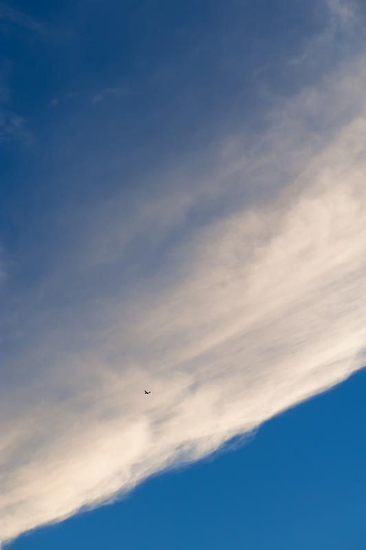 Airplane In The Clouds