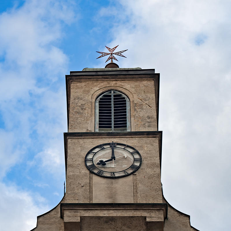 Clock Under Maltese Cross
