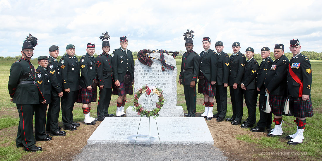 Military honour guard the Sackets Harbor Crown monument