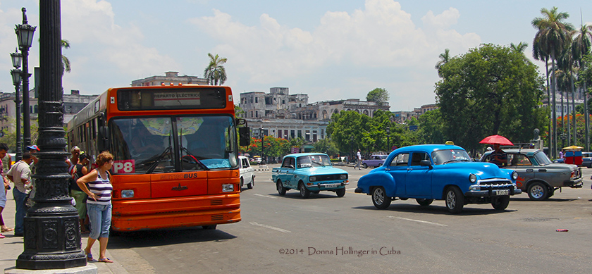 A Bus and cars in the Business District of Havana