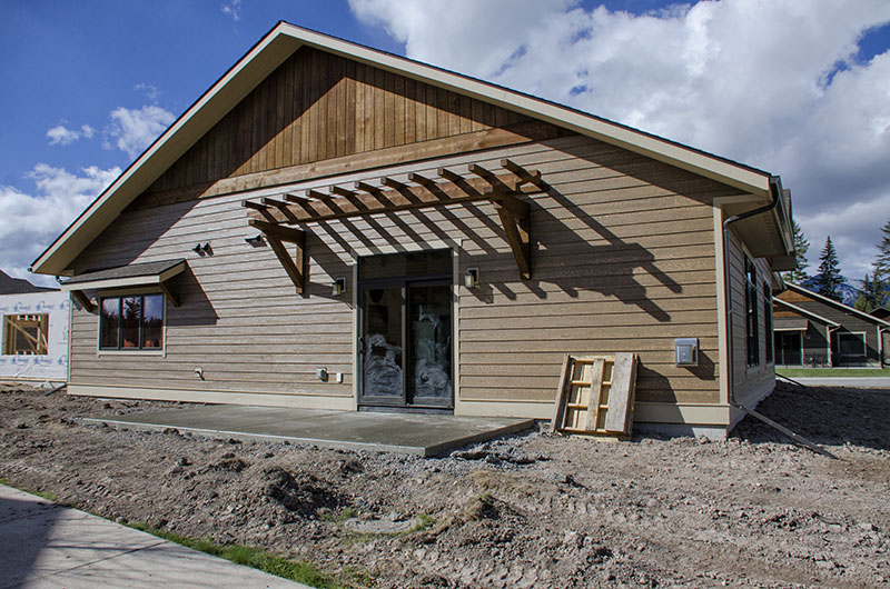 Back of house with new patio