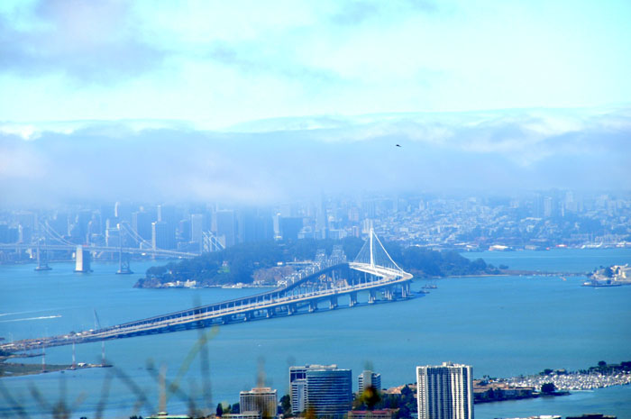 the new and old  Oakland-San Francisco Bay Bridge on the day of closure