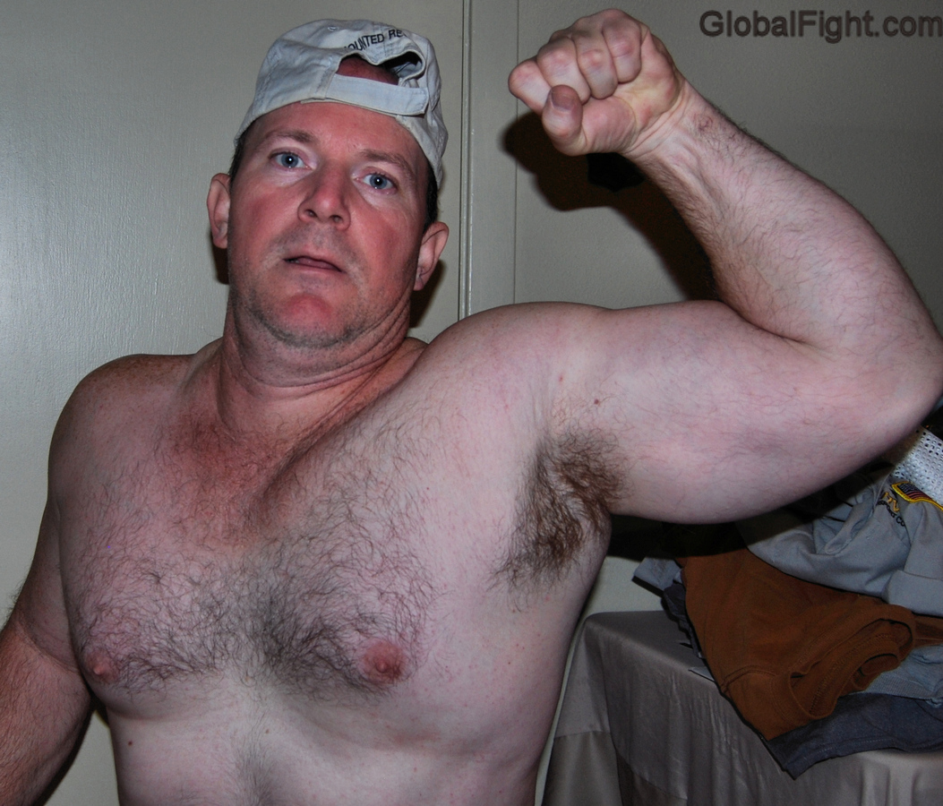 handsome trucker flexing biceps.jpg