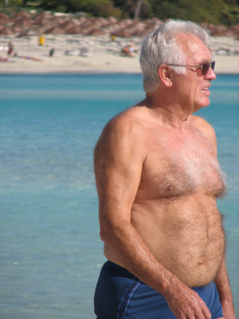 man walking shirtless lake.jpg