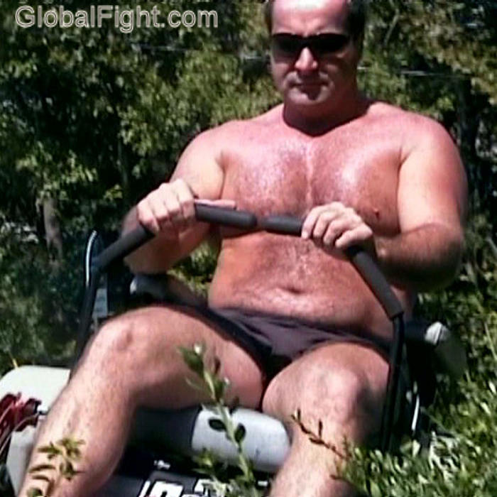 sweaty shirtless man mowing.jpg
