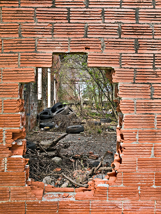 Hole in wall with tires 