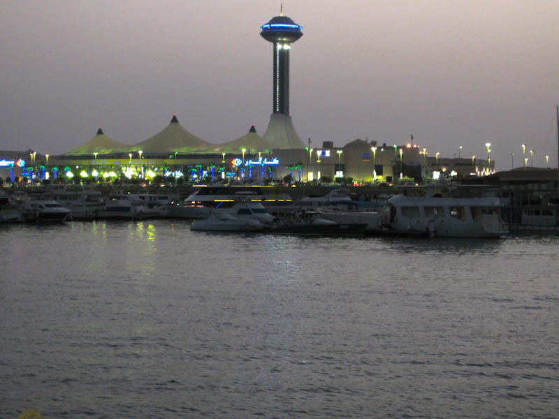 Huge shopping complex lit in early evening