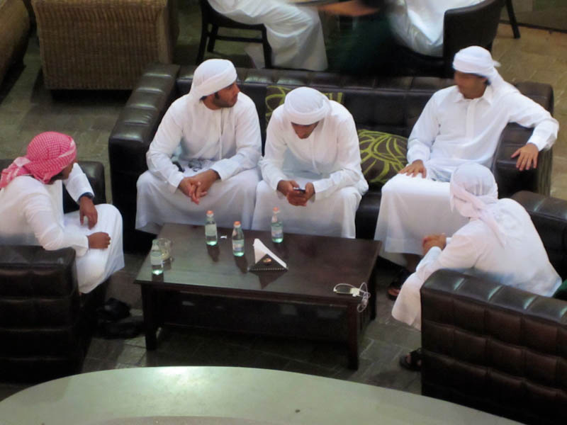 Men enjoying coffee in the shopping complex
