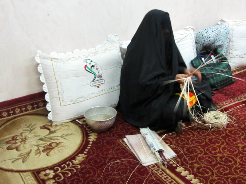 Woman weaving at the Heritage Village
