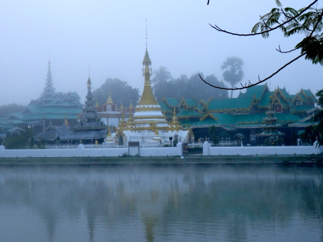 Lakeside temple shrouded in mist